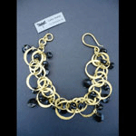 Gold Rings and black onyx bracelet